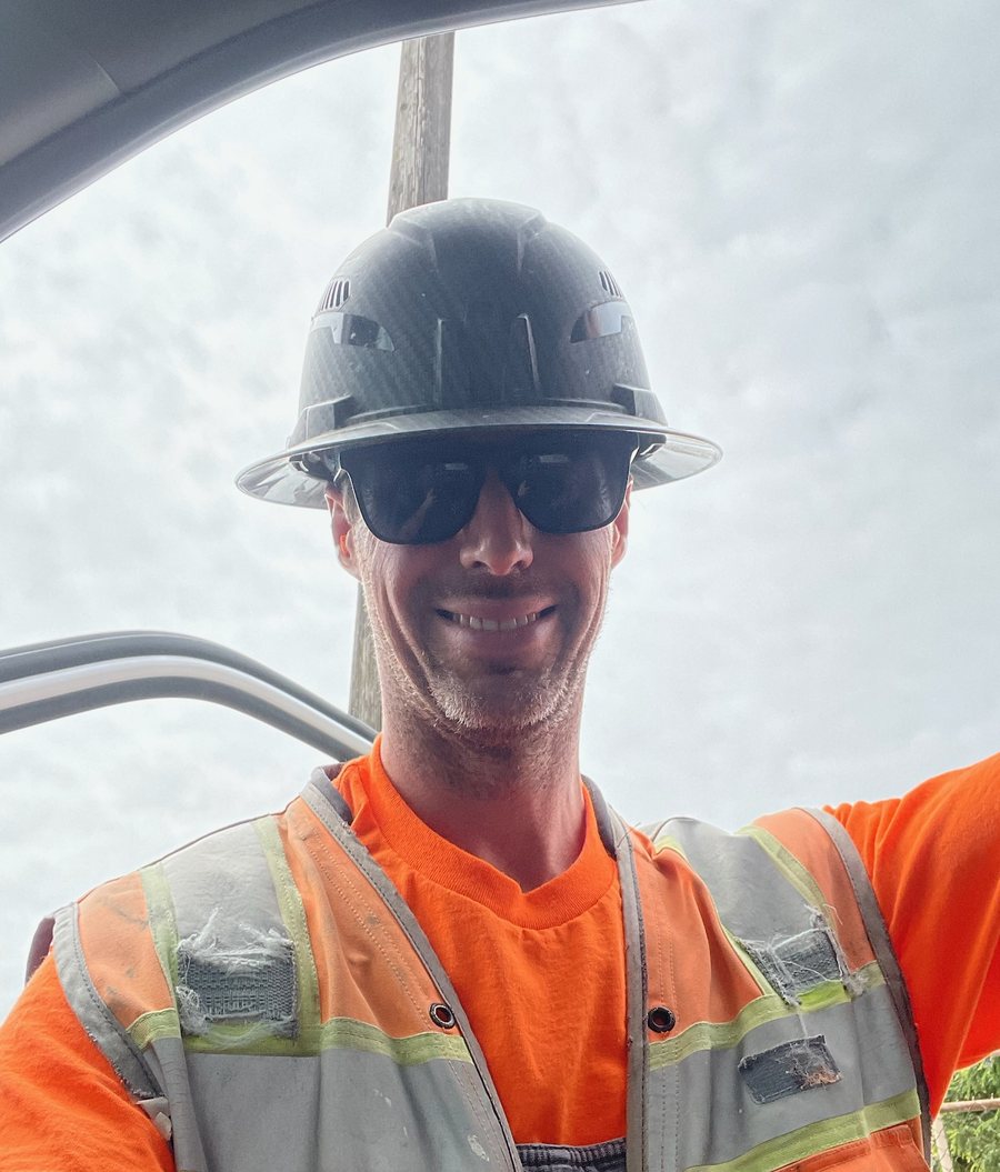 Kevin Foxcroft on site in a hard hat and high-visibility
                      vest, May 2026.